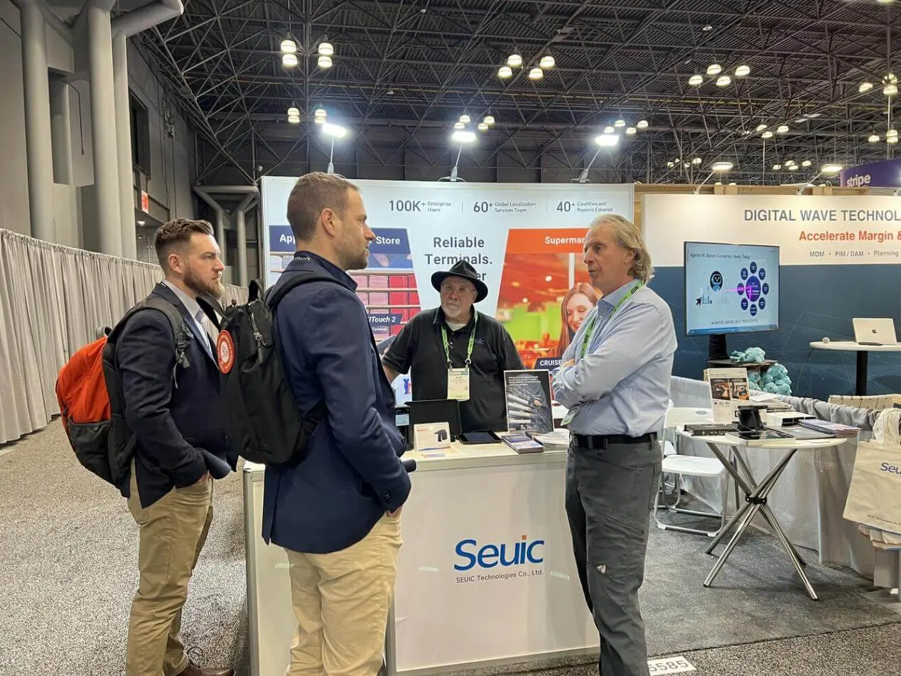 Attendees at the Seuic booth during an exhibition, discussing smart retail solutions under the theme "Reliable Terminals."